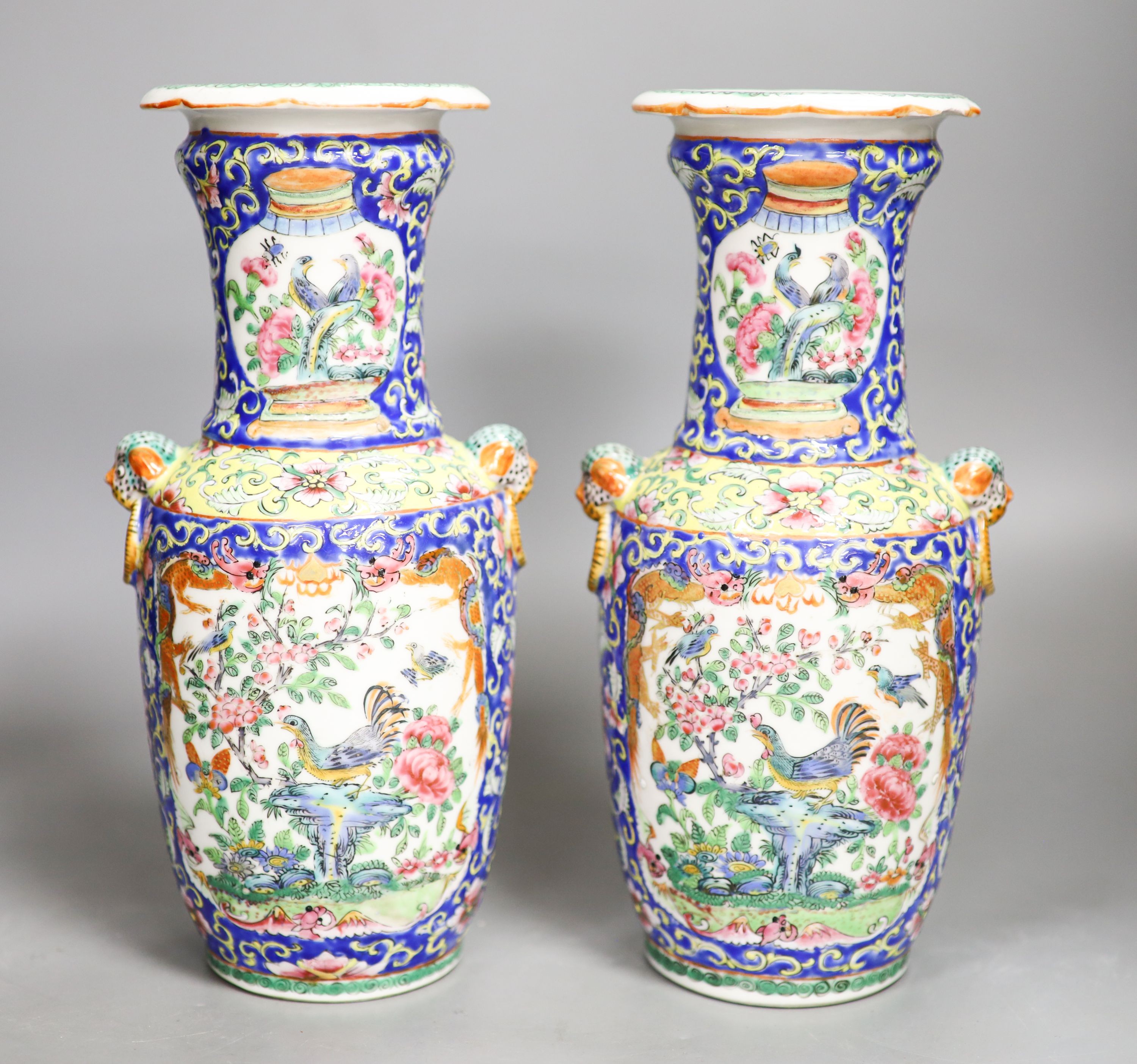 A pair of 19th century Chinese famille rose vases 24.5cm